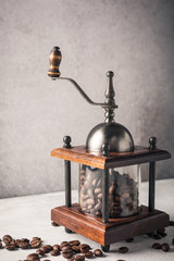 Retro coffee mill with beans, retro slyle toned, copy space.