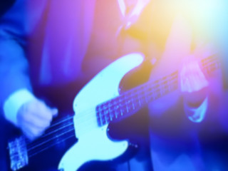 Fototapeta na wymiar abstract blurred image. Actor guitarist playing the guitar. Musician plays a musical instrument on the concert stage.