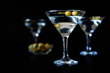 Margarita cocktail alcohol drink in glass with green olives