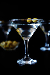 Margarita cocktail alcohol drink in glass with green olives
