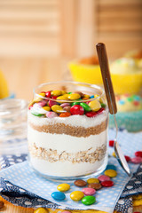 Chocolate chips cookies ingredients in a glass jar.  selective focus