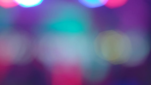 Moving lights blur 4k fast. Middle size multicolored defocused lights background. Abstract motion of many glowing colorful round shapes bokeh circles. Festive mood dance and celebration party disco