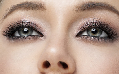 pretty girl make up smoky eyes black mascara close up beauty