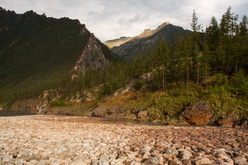 The rocky and dry riverbed in the mountains. Indigirka River. Yakutia. Russia.