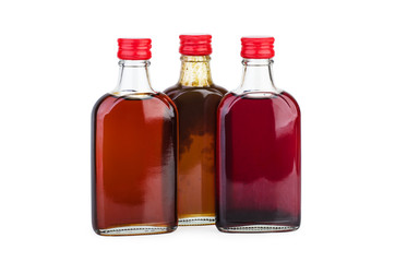 Glass bottles with pomegranate, sea-buckthorn and billberries sirup
