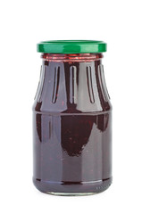 Glass jar with black currants jam isolated on the white background