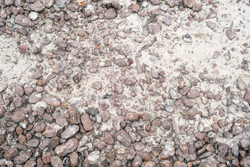 .Fragment of old stone pavement surface texture as a background, top view, horizontal