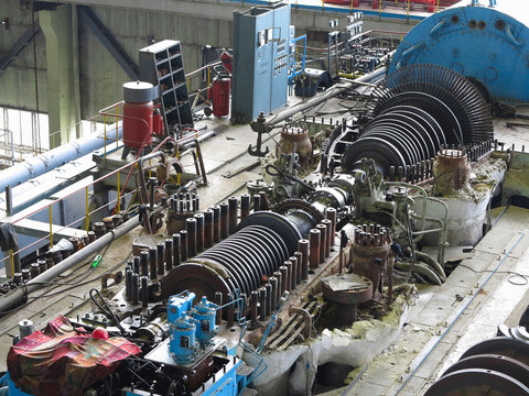 steam turbine in repair process, machinery, pipes, tubes, at pow