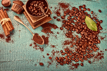 Coffee frame with roasted coffee beans and grinder mill