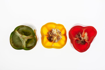 Backlit slices of pepper traffic light, abstract textured background