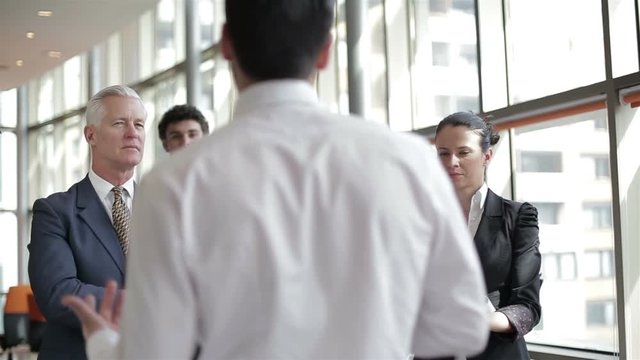 business leader working with his team, making presentation and brainstorming about ideas and projects at office