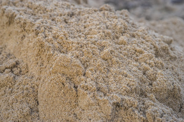 Brown heap of sand material for constructing or the kindergarten