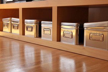 metal storage boxes on shelf