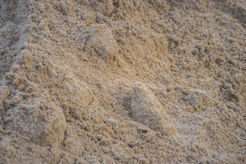 Brown heap of sand material for constructing or the kindergarten