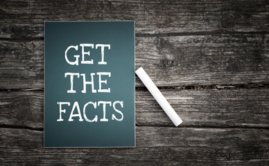 Get the facts text written on chalkboard