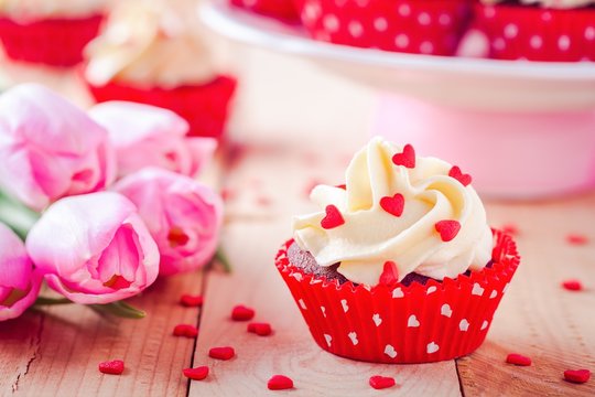 homemade valentine cupcakes with red sugar hearts and pink tulips