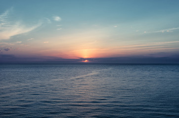 Naklejka na ściany i meble Sunset at sea. Beautiful nature.