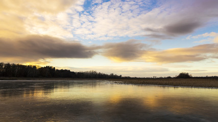 Fototapeta na wymiar Frozen lake in winter beautiful colors.