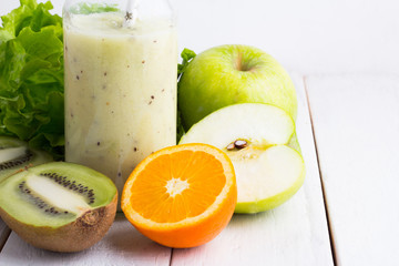green smoothie in a glass bottle
