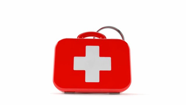 First aid kit with magnifying glass isolated on white background