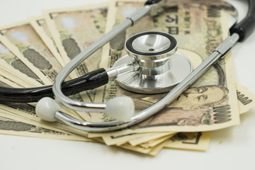 abstract concept of stethoscope and money on isolate - can use to display or montage on product