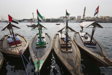 Obraz premium Piers of traditional water taxi boats in Dubai, UAE.