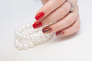 Amazing manicure and natural nails with gel polish. Attractive modern nail art design.