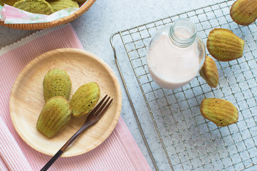Matcha Madeleine is a small tea cake made with ground green tea, melted butter, and beaten eggs.  