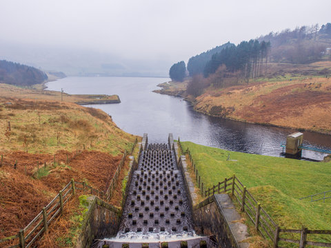 Unusual design of spillway at the Dove stones reservoir on a cloudy winters January day. Oldham, Saddleworth, UK