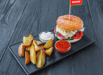 Fast food restaurant dish above view. Hamburger and fries wedges