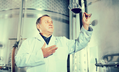 Mature male with glass of wine