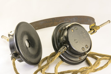 Close up photograph of vintage (1943) WW2 field radio headphones.