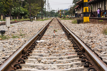 Fototapeta na wymiar The track on a railway or railroad is the structure consisting of the rails, fasteners, railroad ties and ballast, plus the underlying subgrade.