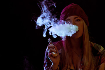 young woman smoking electronic cigarette