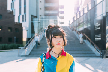 Half length portrait of young beautiful asian millennial woman outdoor in the city, overlooking serene - make up, hair style, skin care concept