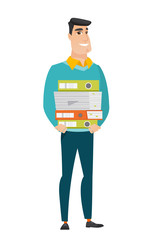 Businessman holding pile of folders.