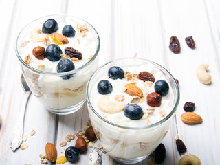 Healthy dessert with yogurt, nuts, oats and blueberries