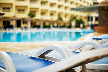 deserted hotel pool in the early morning, horizontal