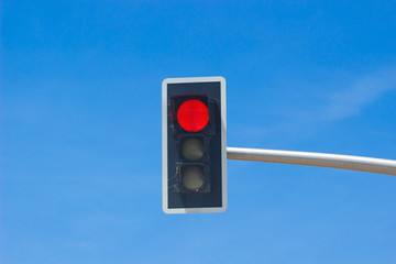 Traffic lights over blue sky background. Red