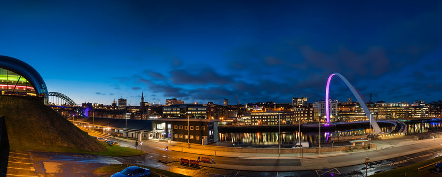 Newcastle Quayside Panorama at night, on the banks of the River Tyne, with its famous bridges and Newcastle upon Tyne skyline beyond