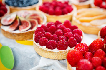 Closeup of raspberry tart dessert tray assorted