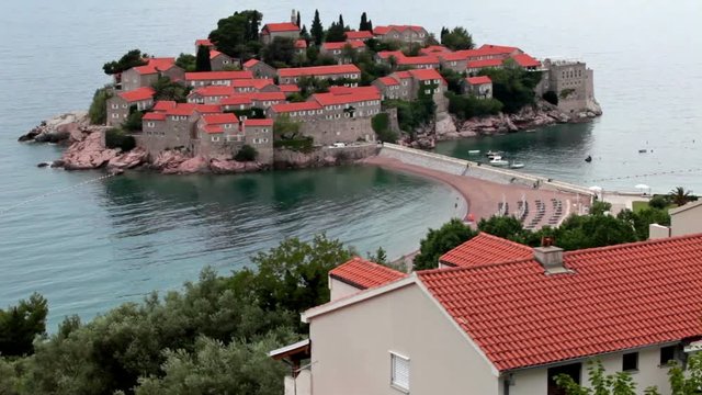 View from city at the Sveti Stefan islet and hotel resort. The Adriatic sea, Montenegro, Europe
