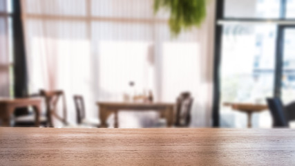 background of wood table with blurred view of cafe