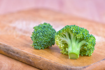Raw broccoli on wooden background