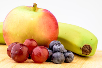 Obraz na płótnie Canvas Fruits, grapes, apples, blueberry