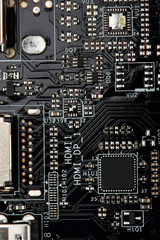 Fototapeta premium Integrated semiconductor microchip microprocessor on blue circuit board representative of the high tech industry and computer science.macro.concept compute harware