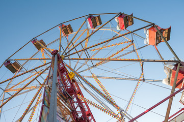 vintage Ferris wheel against a blue sky