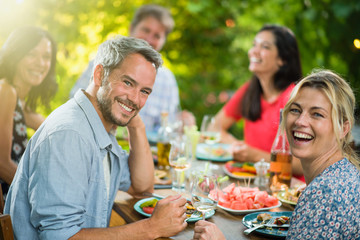  a group of friends gathered around a table on a terrace