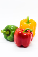 Multi color Bell peppers on white background