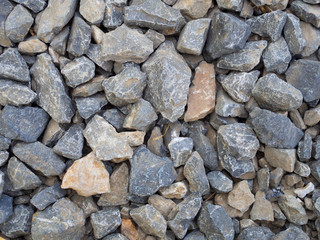 Crushed grey stone on the ground texture background